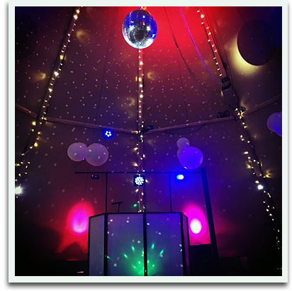 Inside festival wedding marquee, lighting and disco ball