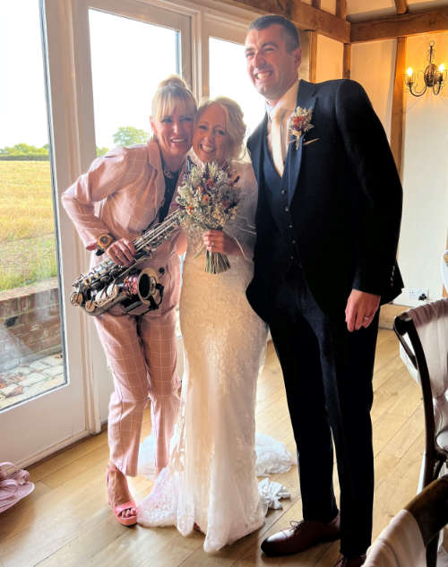 Kay holding Sax, Dancing infront of Sophie and Tom at their wedding in 2022 at Caulty Manor, Maldon